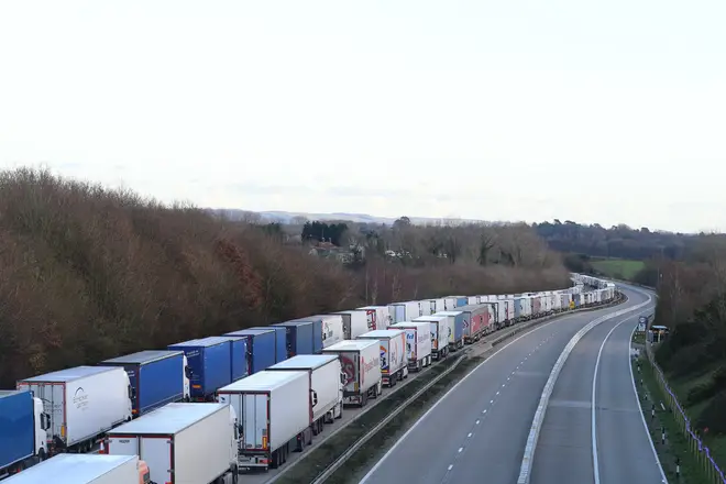 File photo: Freight lorries lined up on the M20 near Ashford, Kent