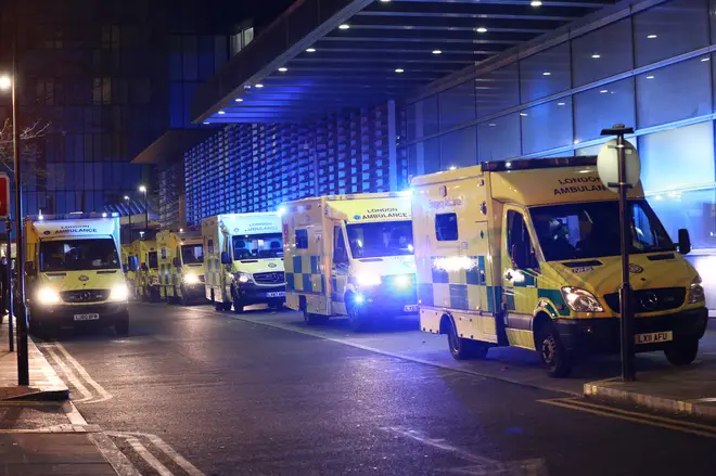 Ambulances queued outside the Royal London Hospital, in London, as hospitals face being overwhelmed.