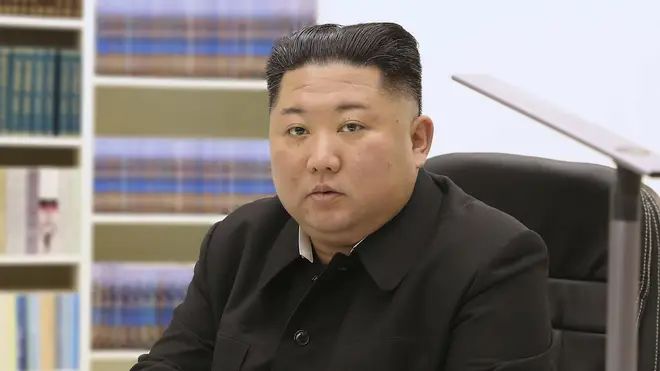 North Korean leader Kim Jong Un writes his New Year card to the public