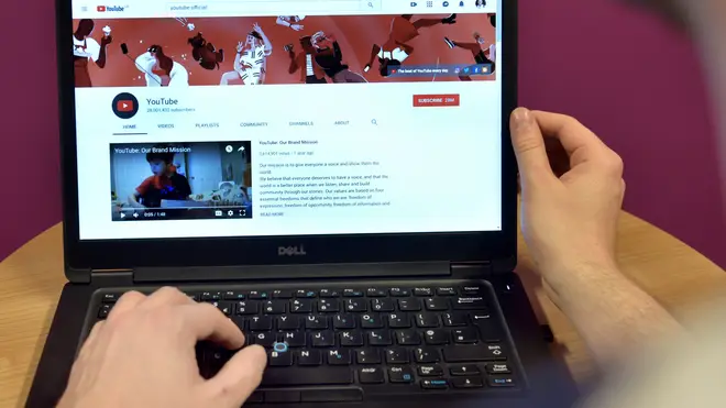 The home page of YouTube displayed on a laptop computer