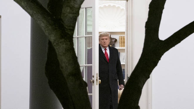 President Donald Trump walks out of the Oval Office (Andrew Harnik/AP)