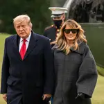 President Donald Trump and first lady Melania Trump walk on the South Lawn of the White House