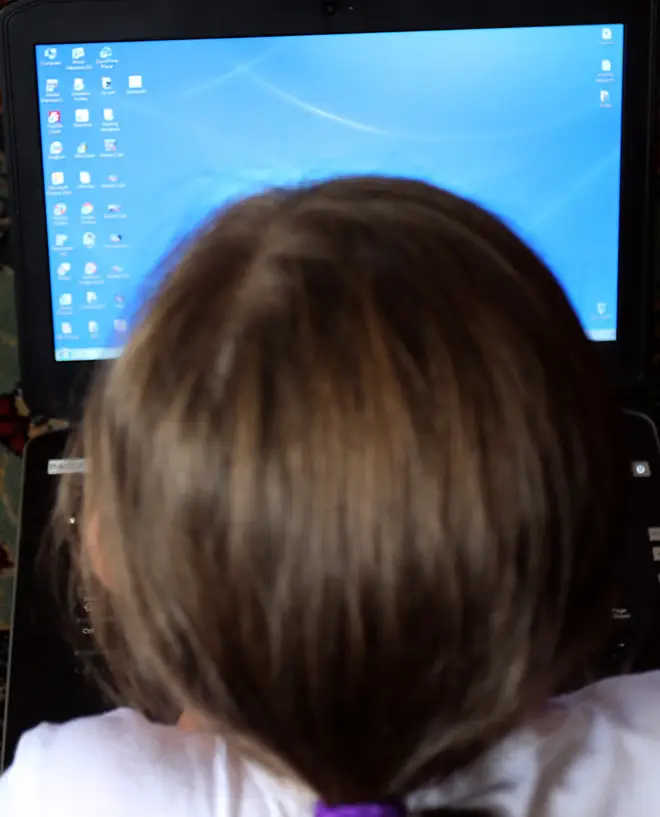 A child using a laptop computer