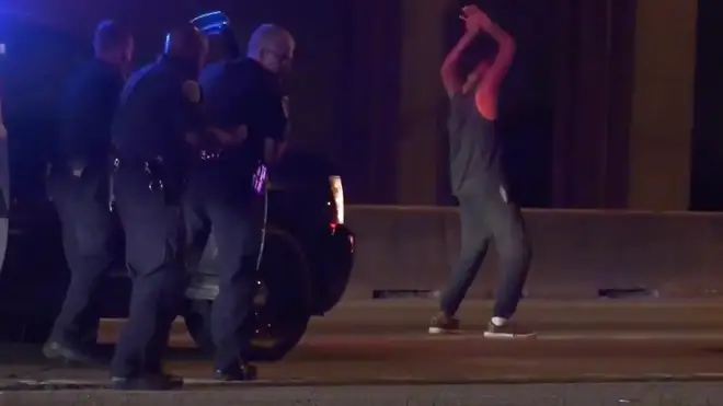The moment the man started dancing as police tried to arrest him