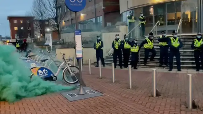 Smoke grenades were set off during protests outside Cardiff Bay Police Station