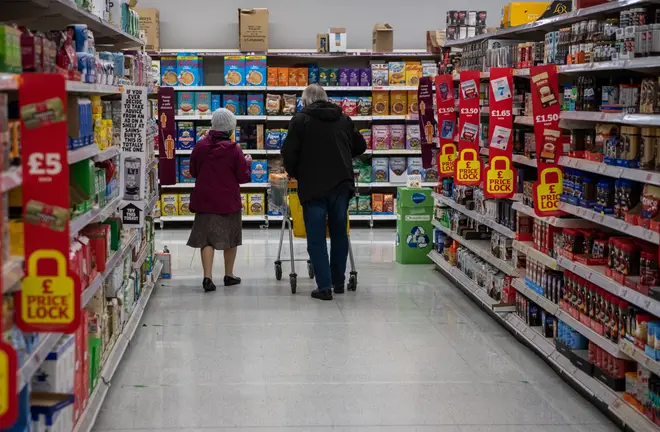 File photo: A couple shop together in a Sainsburys supermarket