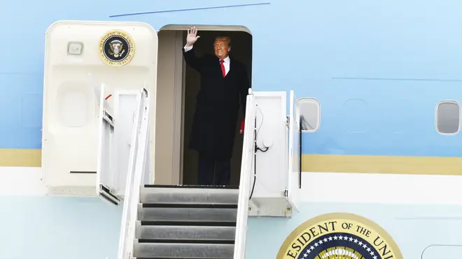 President Donald Trump waves to his supporters (Miguel Roberts/AP)