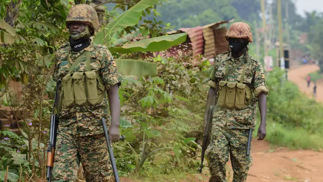Soldiers patrol outside opposition challenger Bobi Wine’s home (Nicholas Bamulanzeki/AP)