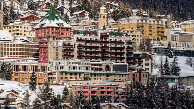 Exterior view of the hotel Badrutt’s Palace, centre, in St Moritz, Switzerland (Giancarlo Cattaneo/AP)