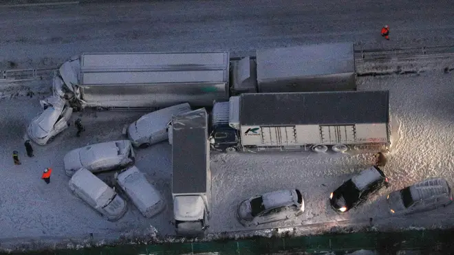 Damaged cars covered with snow after a multi-vehicle accident