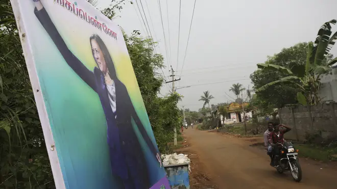A banner featuring U.S. Vice President-elect Kamala Harris with a message wishing her the best is displayed in Thulasendrapuram, the hometown of Ms Harris’ maternal grandfather, south of Chennai, Tamil Nadu state, India (Aijaz Rahi/AP)