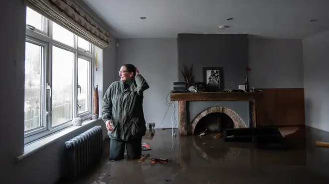 Gabrielle Burns-Smith looks out from her flooded home on the outskirts of Lymm in Cheshire