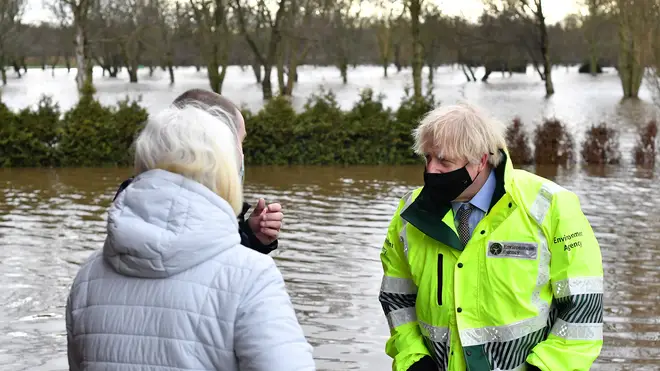 Boris Johnson speaks to residents who have been evacuated in Withington, Manchester