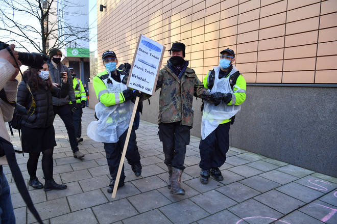 Police moved protesters away from Bristol Magistrates' Court who were demonstrating against the charges