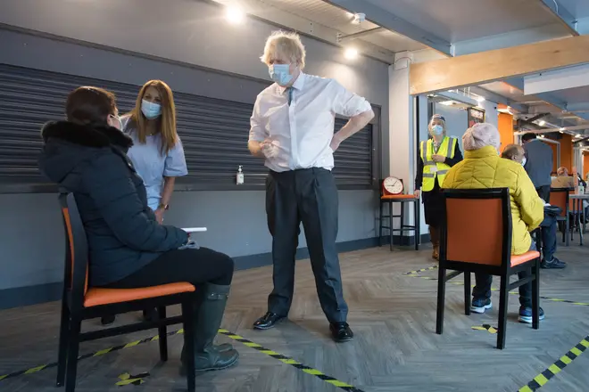 British Prime Minister Boris Johnson meets staff and patients at Barnet FC's ground, The Hive, which is being used as a coronavirus vaccination centre