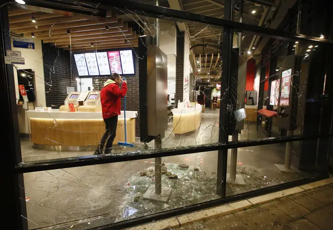 Smashed windows in a fast-food restaurant in Rotterdam that was damaged in protests