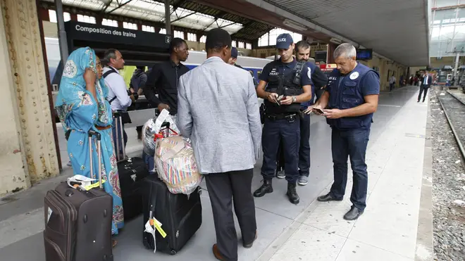 French police check identity documents at Saint-Charles station in Marseille