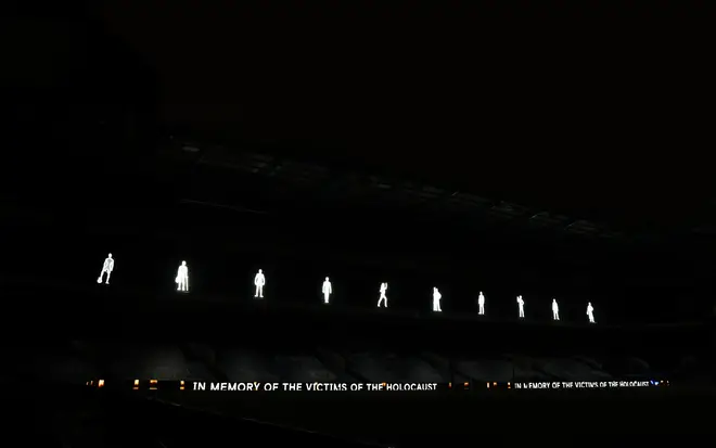 Illuminated figures to mark Holocaust Memorial Day before the Premier League match at Stamford Bridge, London.
