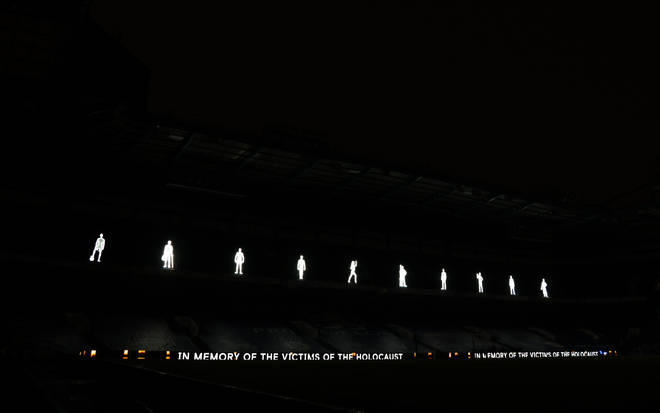 Illuminated figures to mark Holocaust Memorial Day before the Premier League match at Stamford Bridge, London.