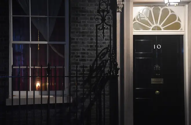 A candle in a window at 10 Downing Street in remembrance of victims of The Holocaust