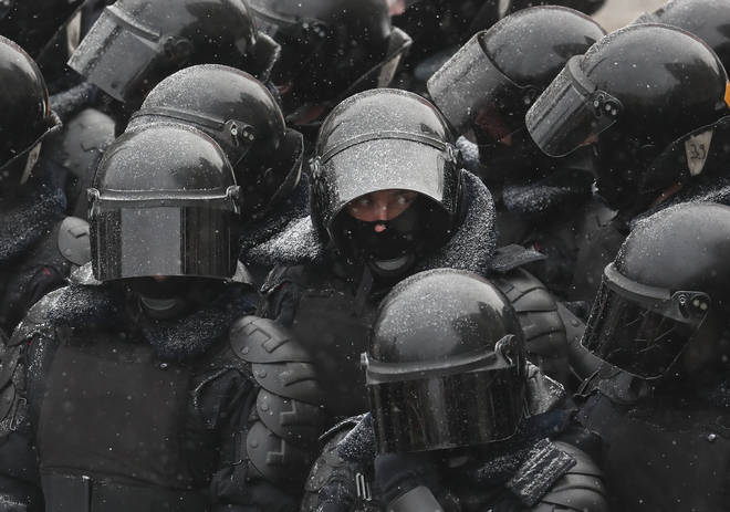 A huge number of riot police were deployed in the snow across Russia.
