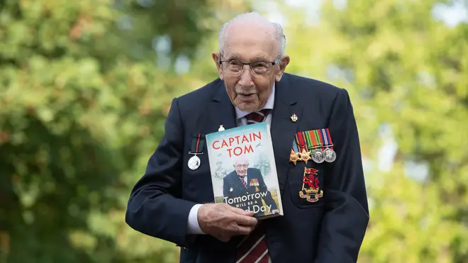 Capt Sir Tom holds his autobiography