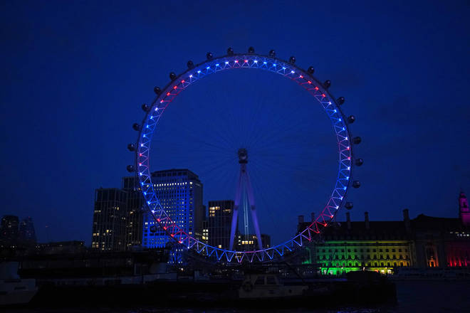 The London Eye lit up red, white and blue for Captain Sir Tom Moore