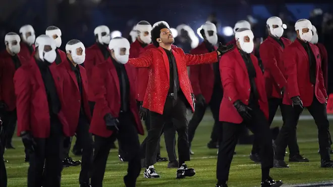 Masked lookalikes joined The Weeknd for his extravagant performance