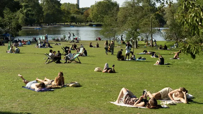 People in Regent's Park in London enjoy good weather