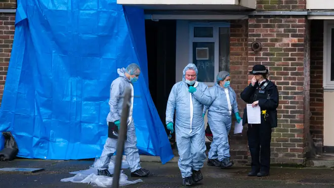 Forensics officers in Wisbeach Road, Croydon, after the fatal stabbing