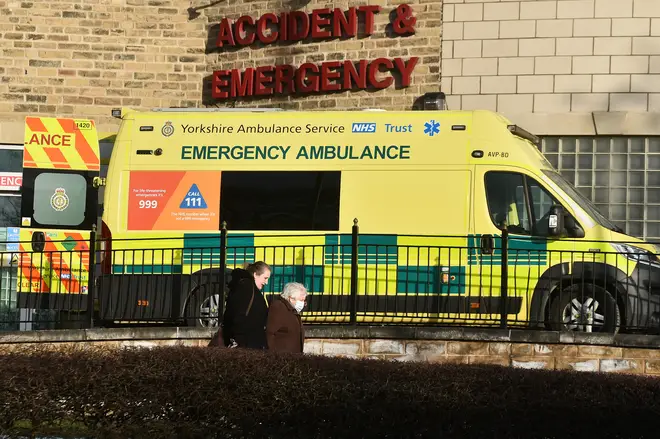 People walks past a accident and emergency department sign in front of an ambulance outside Bradford Royal Infirmary Hospital