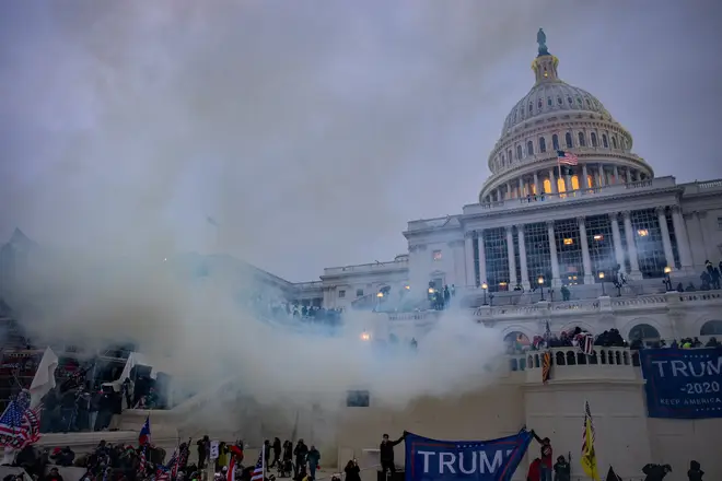 Tear gas is fired at supporters of President Trump who stormed the United States Capitol building