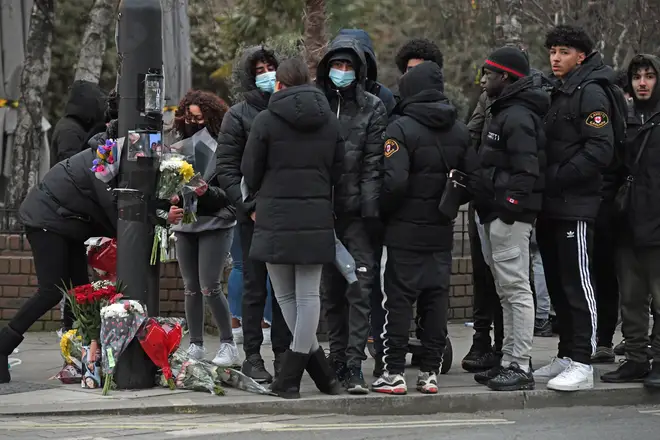 People gathered to place floral tributes and mourn 18-year-old Hani Solomon.