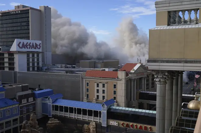 Dust fils the air after the former Trump Plaza casino was imploded