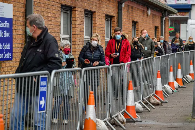 People queue for vaccines outside Cardiff and Vale Therapy Centre in Wales
