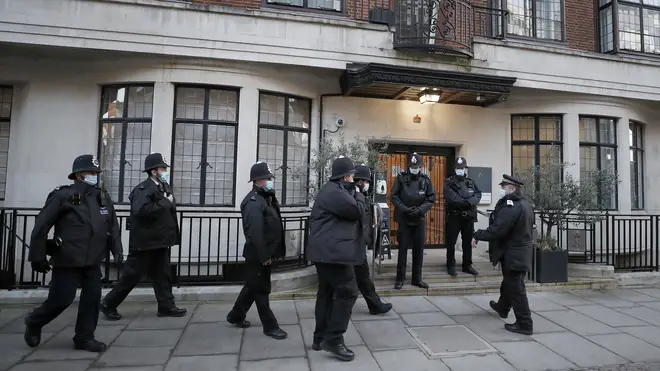 Police officers stand outside King Edward VII's hospital in London
