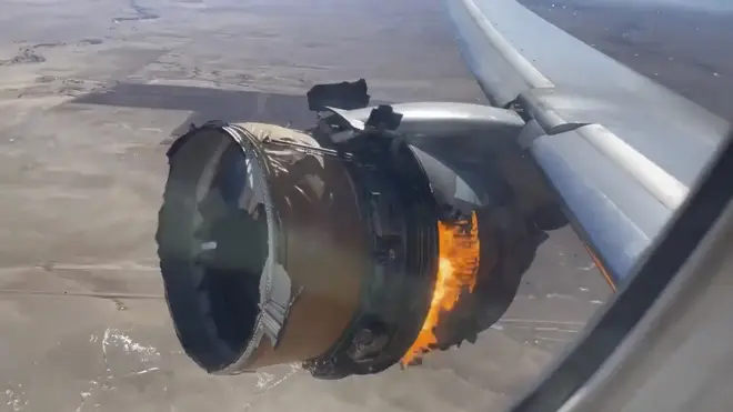 The engine of United Airlines Flight 328 is seen on fire