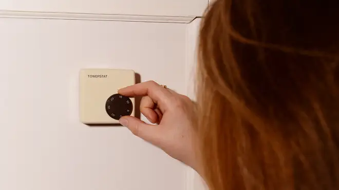 A heating thermostat on a wall