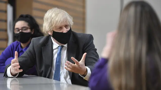 Boris Johnson meets with Year 11 students in the canteen during a visit to Accrington Academy 