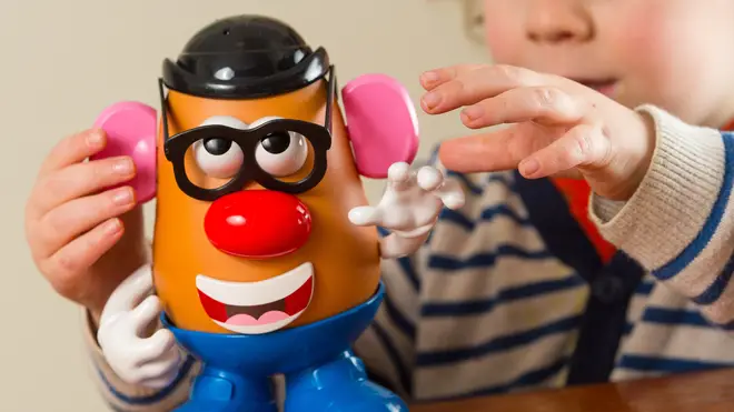 A child plays with a Mr Potato Head
