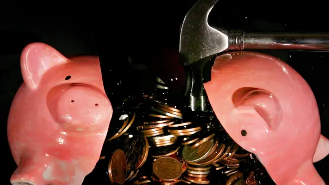 A piggy bank smashed open with a hammer