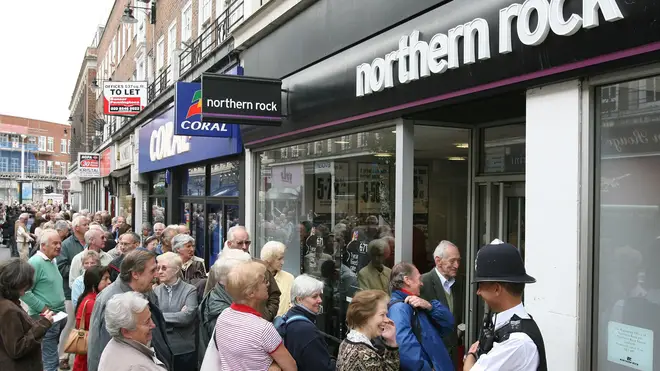 Northern Rock customers queue outside a branch