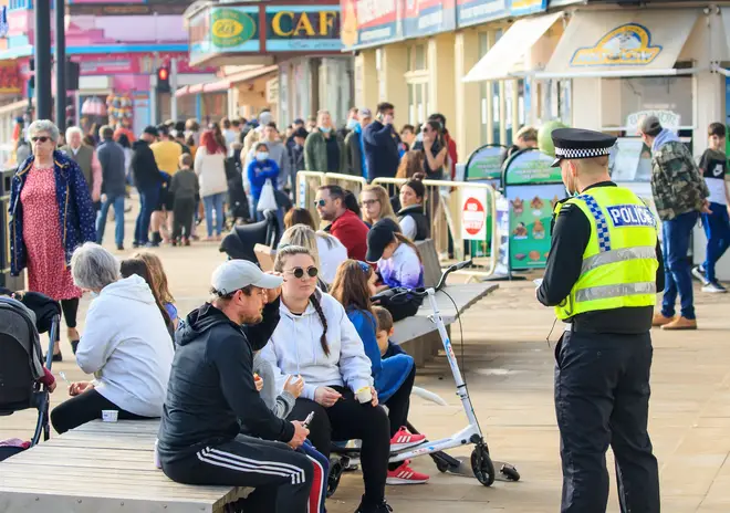 Police officers spoke to people in Scarborough, North Yorkshire, as crowds gathered