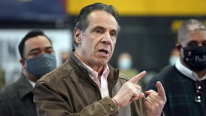 Andrew Cuomo speaks with his hands up near his face