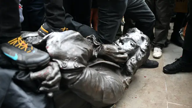 The Edward Colston statue at the feet of protesters