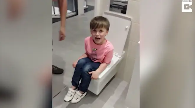 Six-year-old Alfie became stuck in the toilet at a bathroom store
