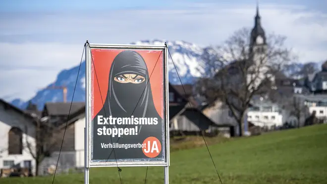 A poster supporting the ban on face coverings