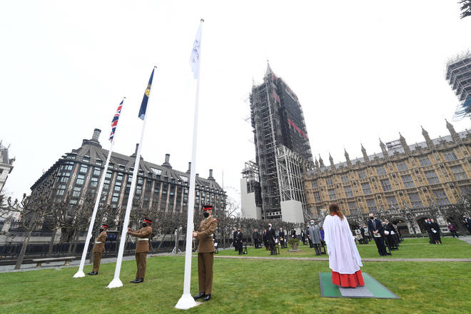 A flag to mark International Women's Day was unfurled outside Parliament on Monday morning.