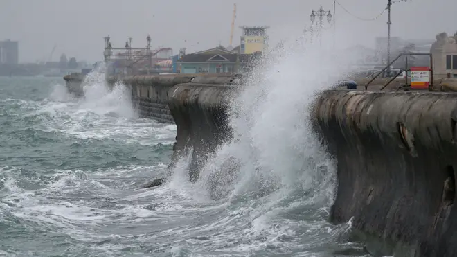 Waves crash against the sea wall along Clarence Esplanade in Southsea, Hampshire, on Wednesday