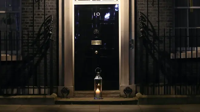 A large candle was laid on the doorstep of 10 Downing Street